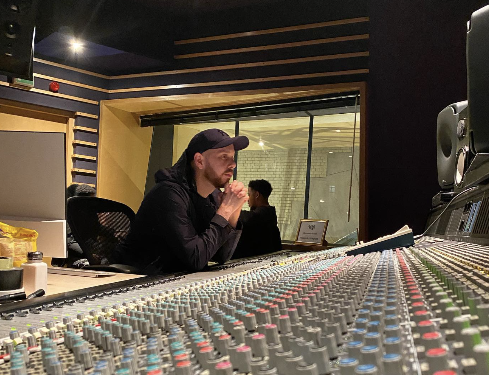 Sean D listening at the mixing desk
