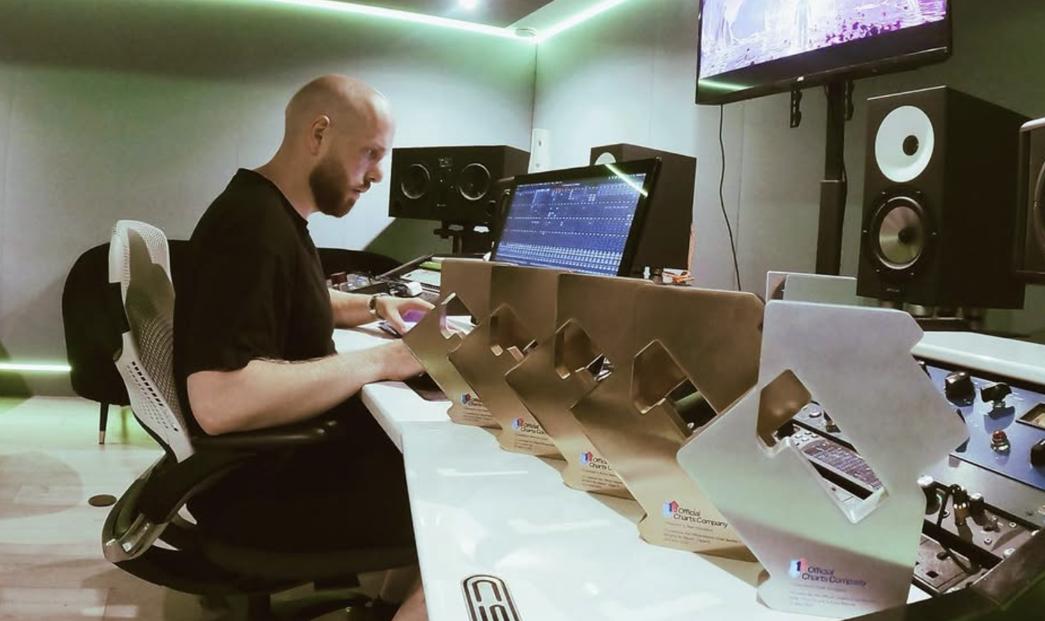 Sean D working beside his chart awards